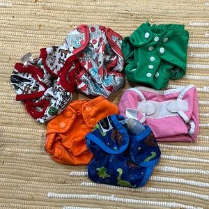 Newborn cloth diapers with covers, snappis, and large wet bag